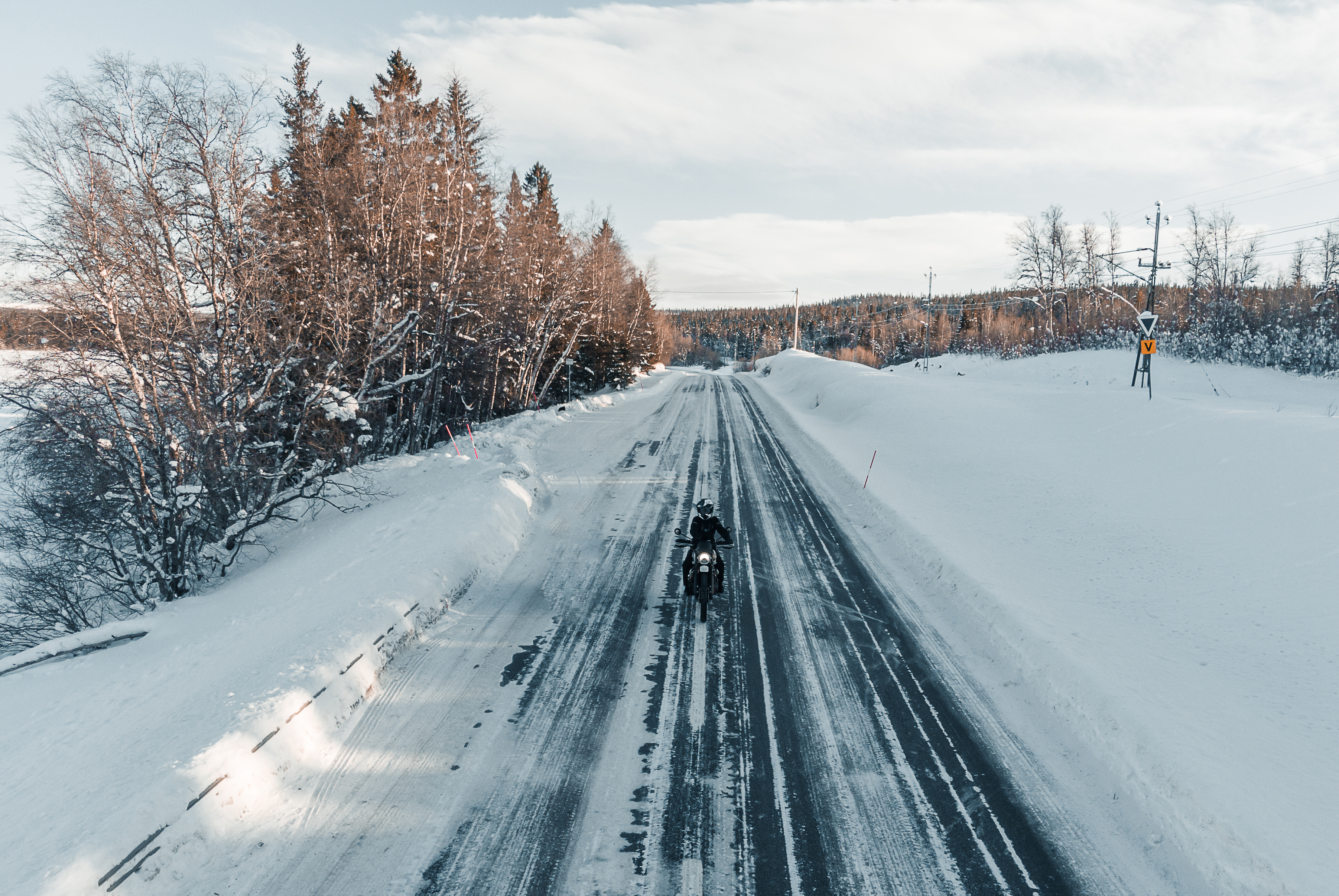 2 people on triumph bikes wearing triumph gore-tex clothing